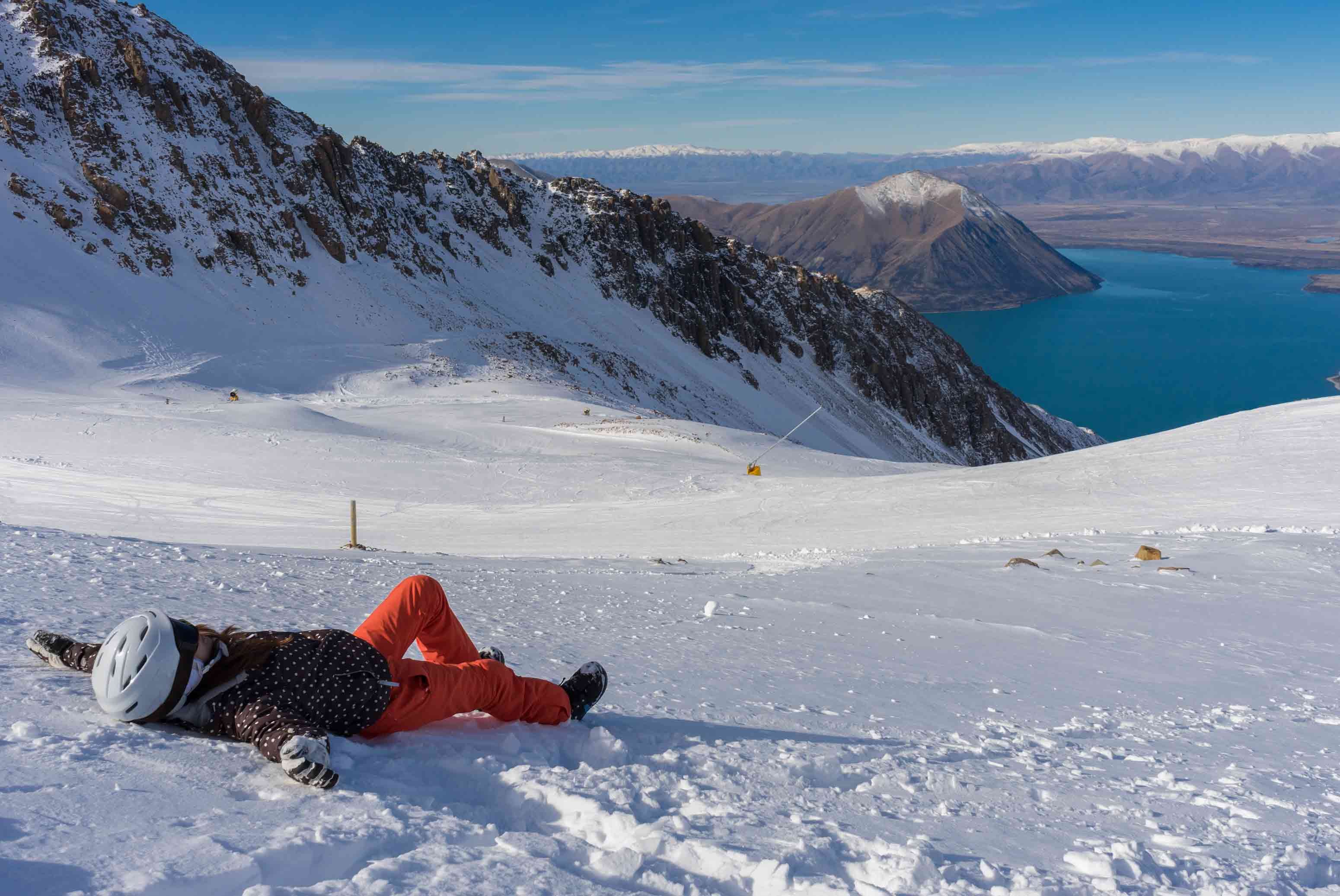 skier lieing down in south island ski field